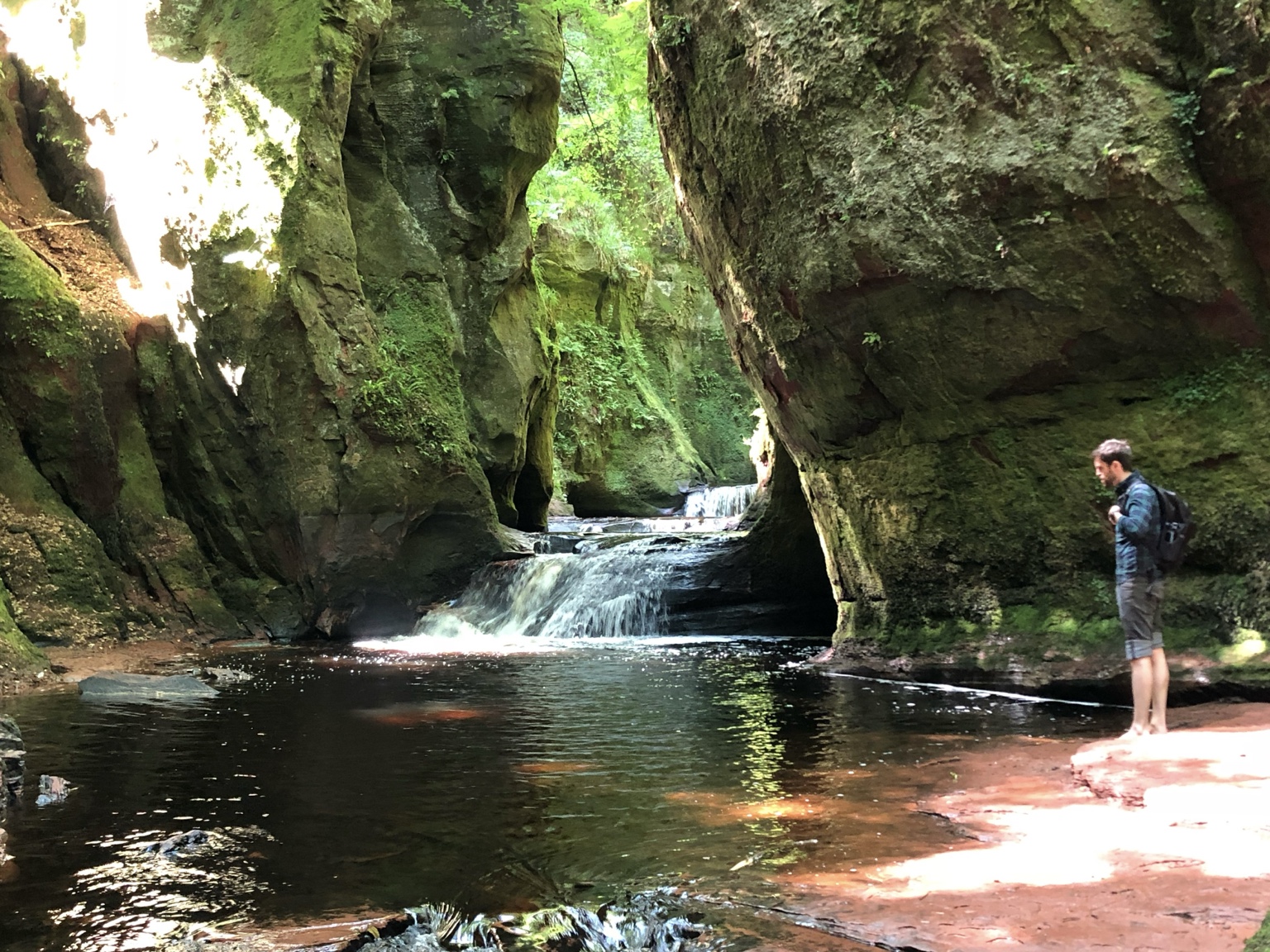 Mike exploring Devil’s Pulpit, a mossy waterfall gorge in Scotland