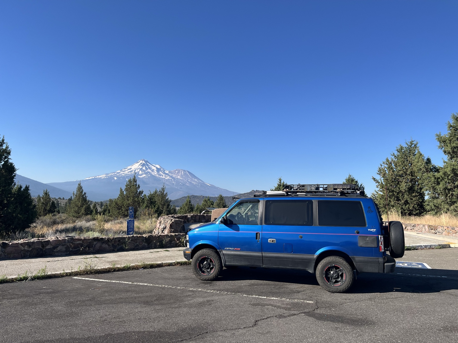Blue Chevy Astro with Mount Shasta in the distance