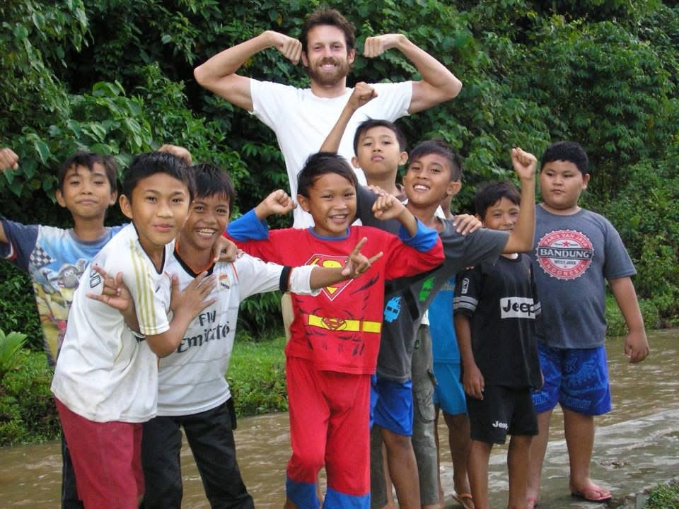 Mike with people he met while traveling in Krui, Sumatra