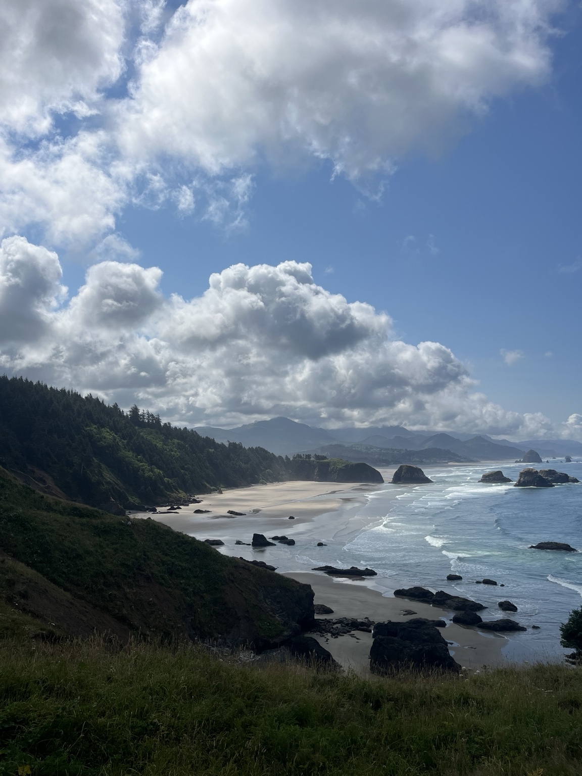 Rocky coastline beneath clouds at Ecola State Park
